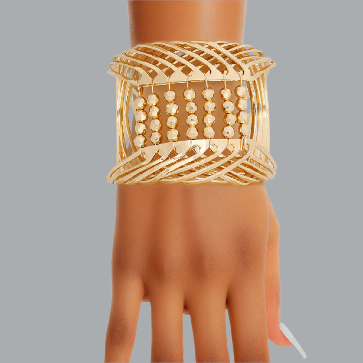 Women's Cuff Bracelet Rigid Gold Metal Rounded Design Cuff Featuring Gold Bead Detailing. Adjustable. Cuff measures 2.65" wide.