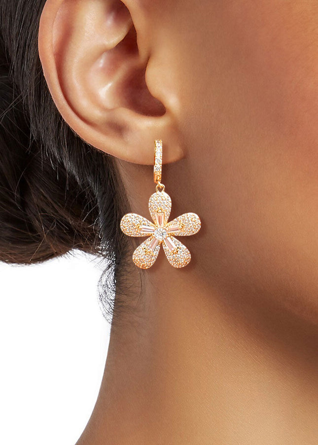 14k Gold Plated Cubic Zirconia Pave Rhinestone Huggie Hoop Earrings Featuring Flower Charm Drop Detail. Earrings measure .78 inches wide.