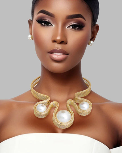 Women's Bib Necklace Set Bold Statement Rigid Chunky Gold Metal Mesh Chain Necklace Featuring Triple Teardrop Shaped Cream Pearl Bib Detail. Bib measures 3.25" x 5.5". Rigid Mesh Chain measures .85" wide. Lobster Clasp Closure. Includes Matching Pearl Ball Stud Post Backing Earrings.