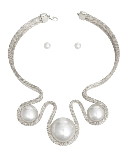 Women's Bib Necklace Set Bold Statement Rigid Chunky Silver Metal Mesh Chain Necklace Featuring Triple Teardrop Shaped White Pearl Bib Detail. Bib measures 3.25" x 5.5". Rigid Mesh Chain measures .85" wide. Lobster Clasp Closure. Includes Matching Pearl Ball Stud Post Backing Earrings.