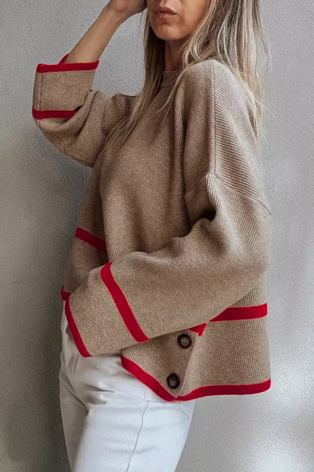 Beige sweater with red accents