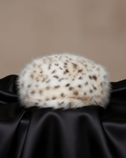 Women's Winter Hat. Instant Glamor Luxe Faux Fur Bold White and Beige Leopard Print Beret Winter Hat. Ultra-Soft and Effortlessly Chic. Perfect Statement for Cold Weather Winter Styling. Soft Interior Lining. Cap Measures 3 inches Tall and 8.25 inches Wide. 100% Polyester.