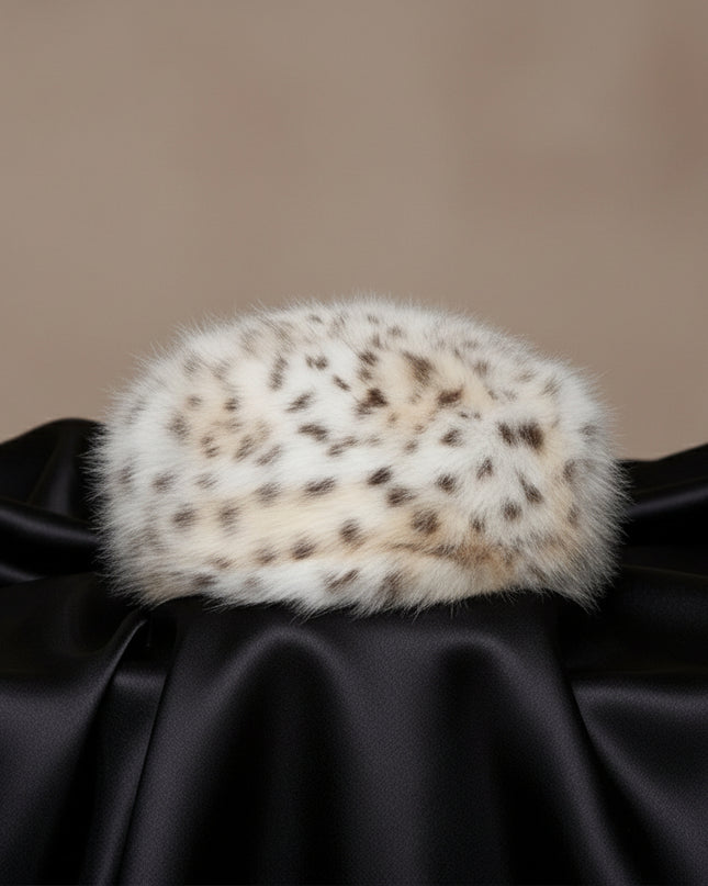 Women's Winter Hat. Instant Glamor Luxe Faux Fur Bold White and Beige Leopard Print Beret Winter Hat. Ultra-Soft and Effortlessly Chic. Perfect Statement for Cold Weather Winter Styling. Soft Interior Lining. Cap Measures 3 inches Tall and 8.25 inches Wide. 100% Polyester.