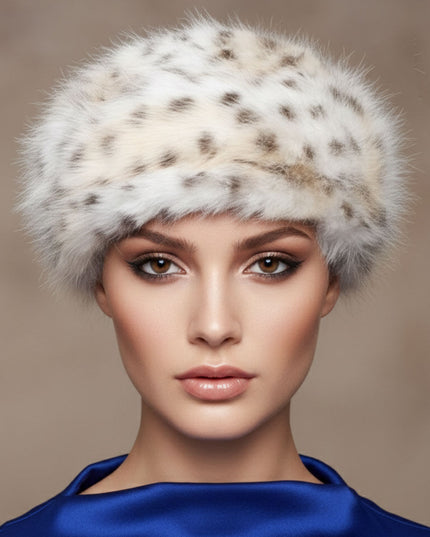 Women's Winter Hat. Instant Glamor Luxe Faux Fur Bold White and Beige Leopard Print Beret Winter Hat. Ultra-Soft and Effortlessly Chic. Perfect Statement for Cold Weather Winter Styling. Soft Interior Lining. Cap Measures 3 inches Tall and 8.25 inches Wide. 100% Polyester.