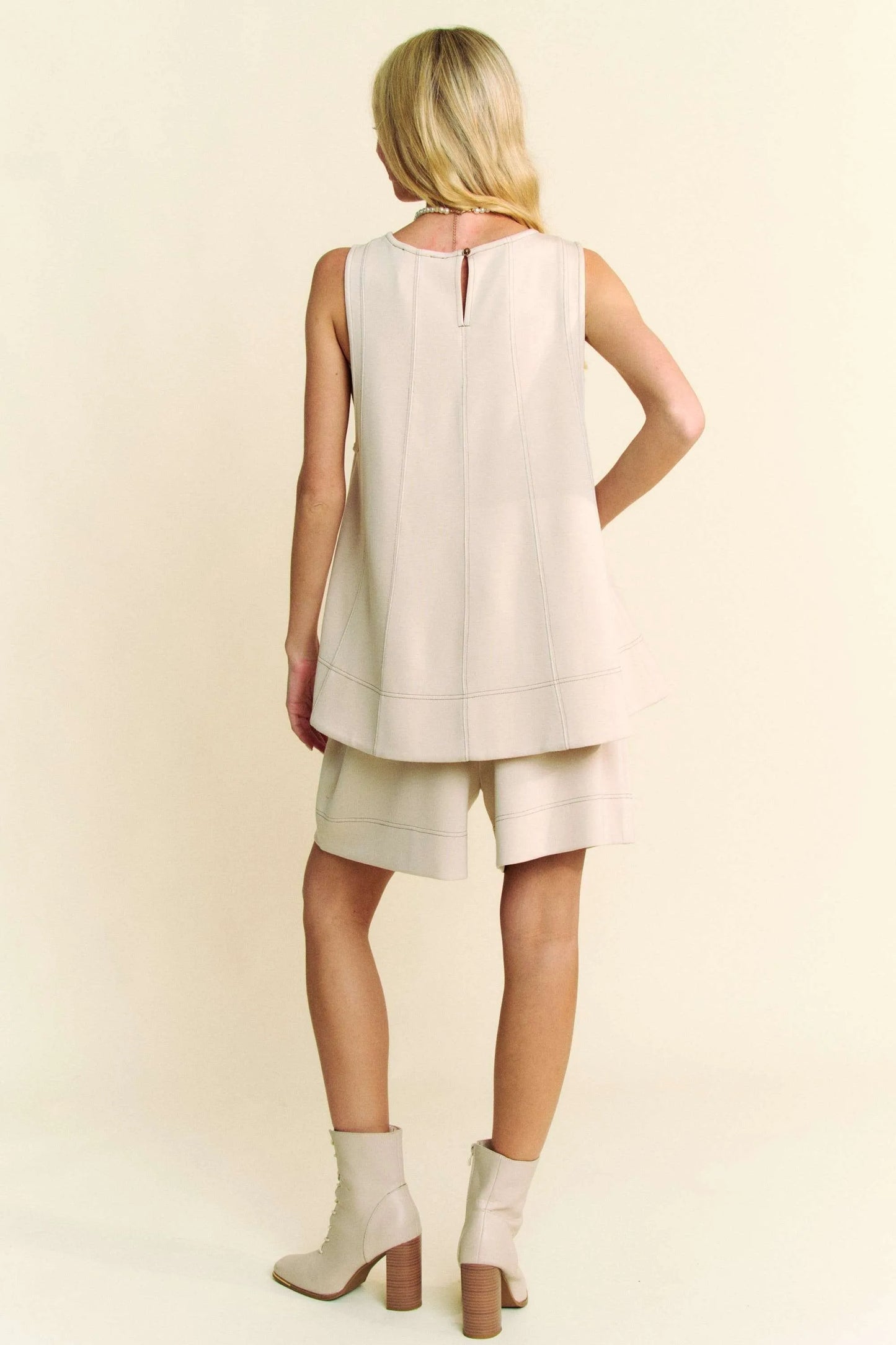 This top and short set features trendy contrast seam detailing for a modern look. The set is perfect for lounging at home or running errands in style. The comfortable fabric ensures all-day comfort, while the matching design makes it easy to put together effortless outfits. Stay chic and comfortable with this coordinated and short set!