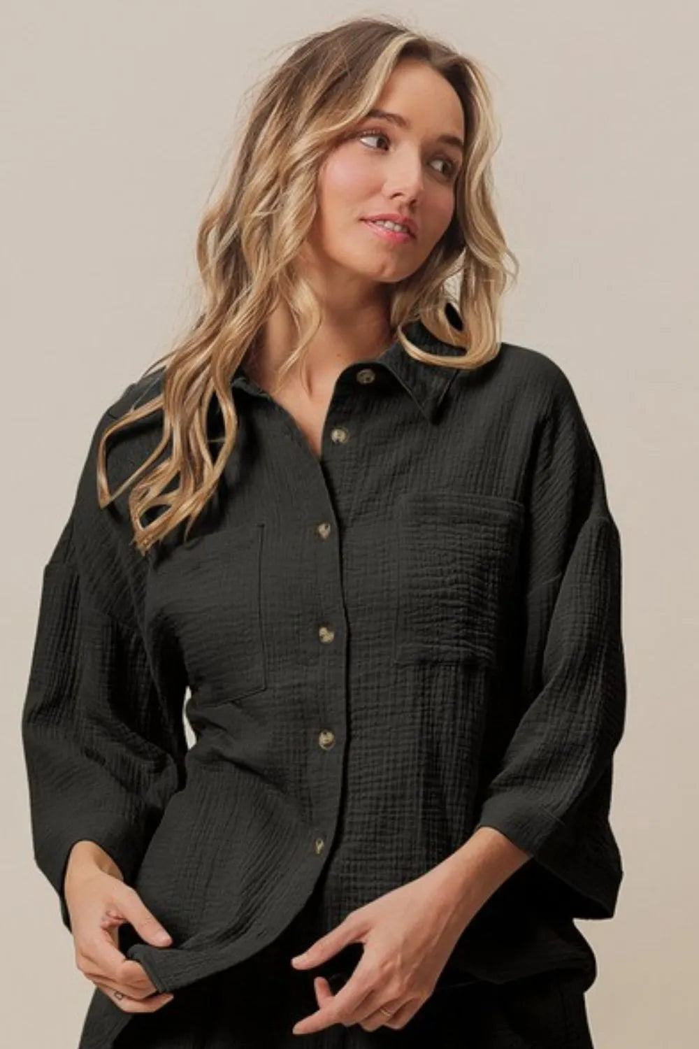 The Crinkle Gauze Shirt and Short Set is a fashionable and comfortable ensemble featuring a shirt and matching shorts made from lightweight crinkle gauze fabric. This coordinating set offers a breezy, casual style perfect for warm-weather days or relaxed outings. The crinkled texture adds a laid-back vibe to the outfit while keeping you cool and stylish