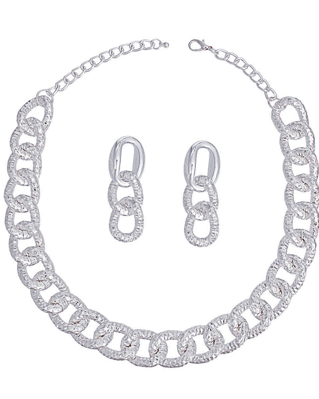 Women's Chain Necklace Set Shiny Oversized Silver Diamond Cut Textured Link Chain Necklace. Each Link measures 1" x .75". Silver Metal Lobster Clasp Closure. Includes Duo Texture Matching Chain Link Drop Post Earrings. Earrings measure 2.5" x .75".
