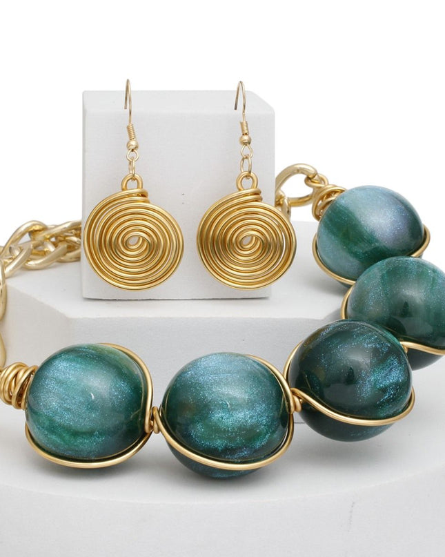 Women's Collar Necklace Set. Glossy and Galactic Chunky Gold Metal Chain Necklace with Eye-catching Centerpiece Collar Comprised of Jumbo Green Resin Ball Beads Featuring Swirled Glitter Inlay and Hand-wrapped Gold Metal Wire Detail. 