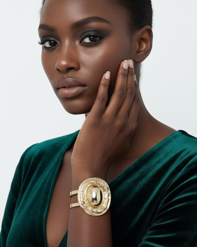 Women's Cuff Bracelet. Office to Evening Versatility Cut Out Gold Metal Double Bar Wrap Adjustable Cuff Bracelet Featuring Gold Metal Fluid Form Organic Oval Shape with Domed Center. Oval Measures 2.2 inches x 1.75 inches. Cuff Portion Measures .85 inches wide.