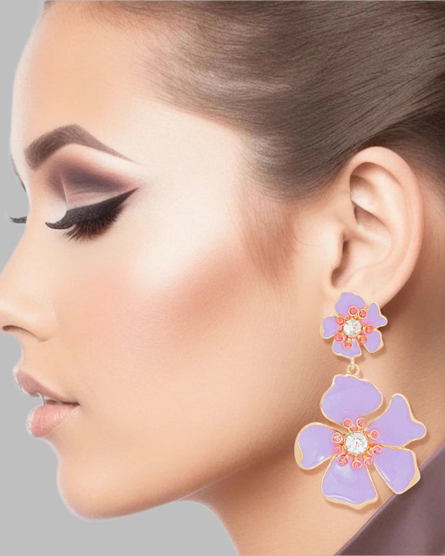 Women's Drop Earrings Gold Metal and Lavender Epoxy Tropical Flower Shaped Post Backing Earrings with Matching Larger Flower Drop Detail. Earrings Feature Rhinestone Center Detailing.