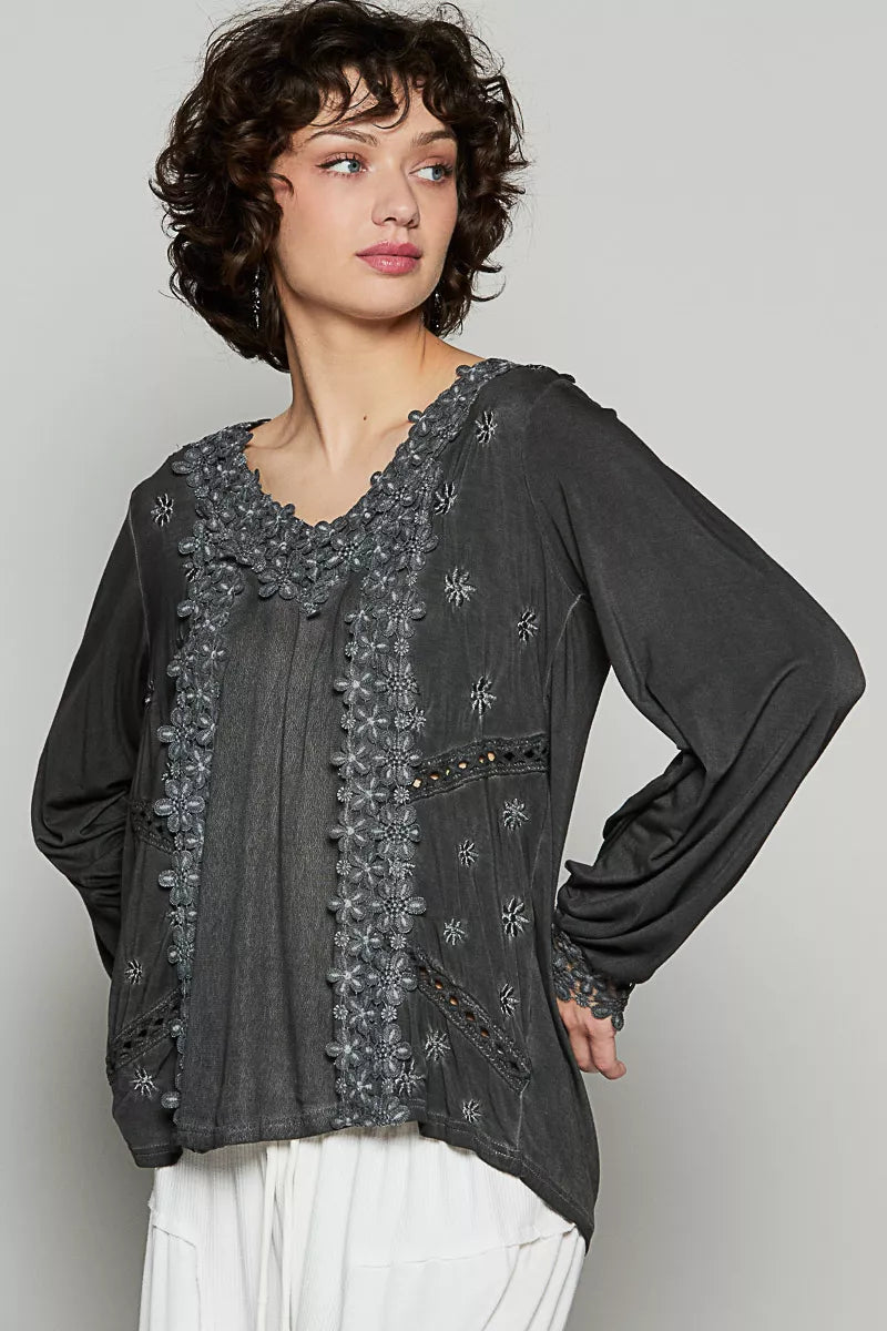 The Floral Embroidery Woven Top offers a relaxed fit and delicate floral lace trim along the low V neckline. Floral embroidery detailing on the side front adds a charming touch to the design. 