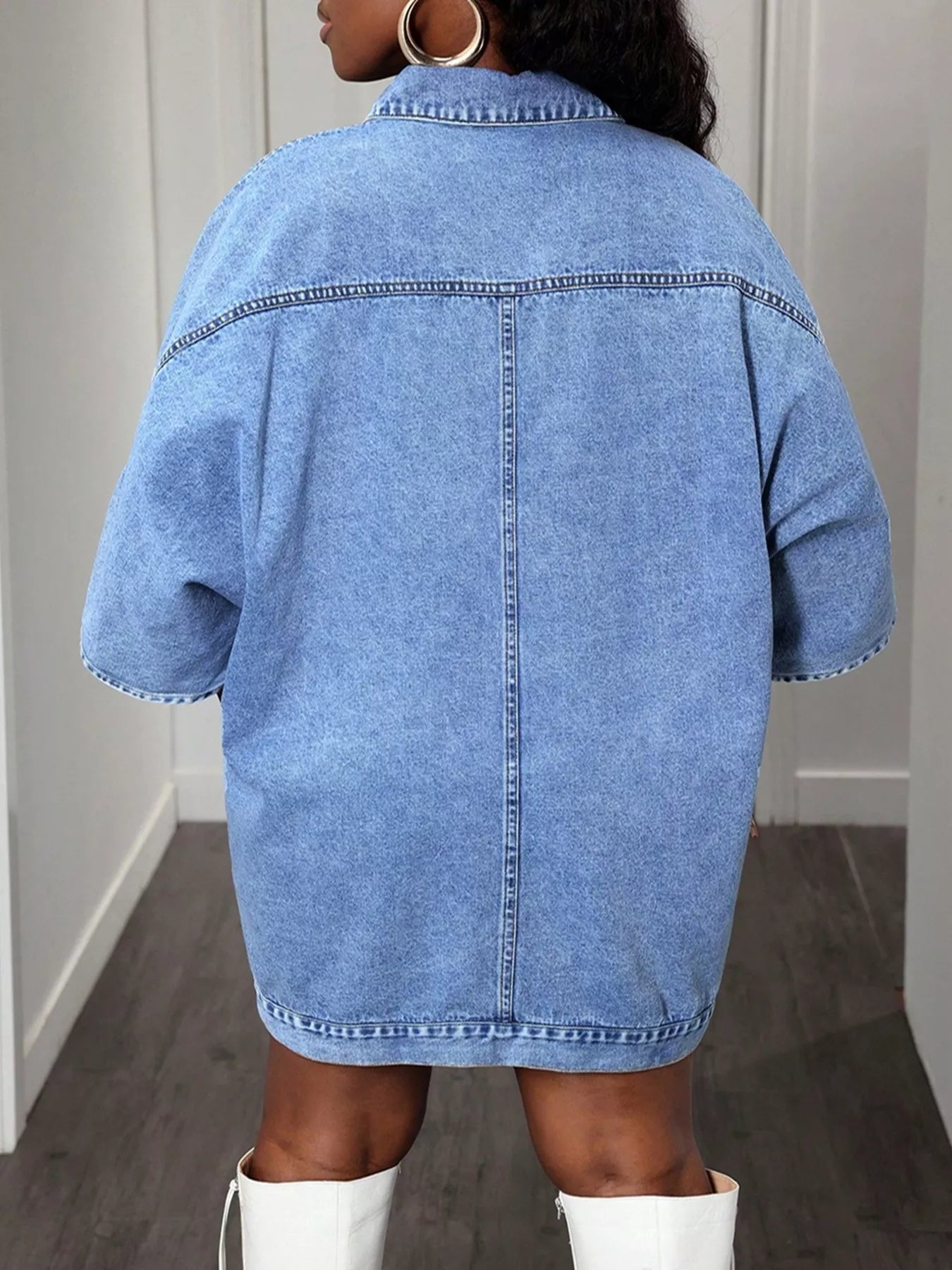 Blue denim top/jacket in a neutral setting