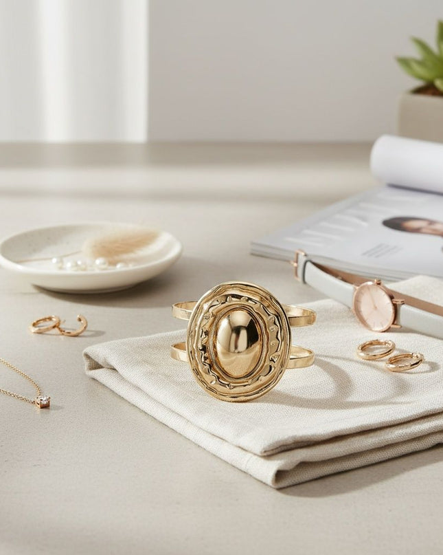 Women's Cuff Bracelet. Office to Evening Versatility Cut Out Gold Metal Double Bar Wrap Adjustable Cuff Bracelet Featuring Gold Metal Fluid Form Organic Oval Shape with Domed Center. Oval Measures 2.2 inches x 1.75 inches. Cuff Portion Measures .85 inches wide.