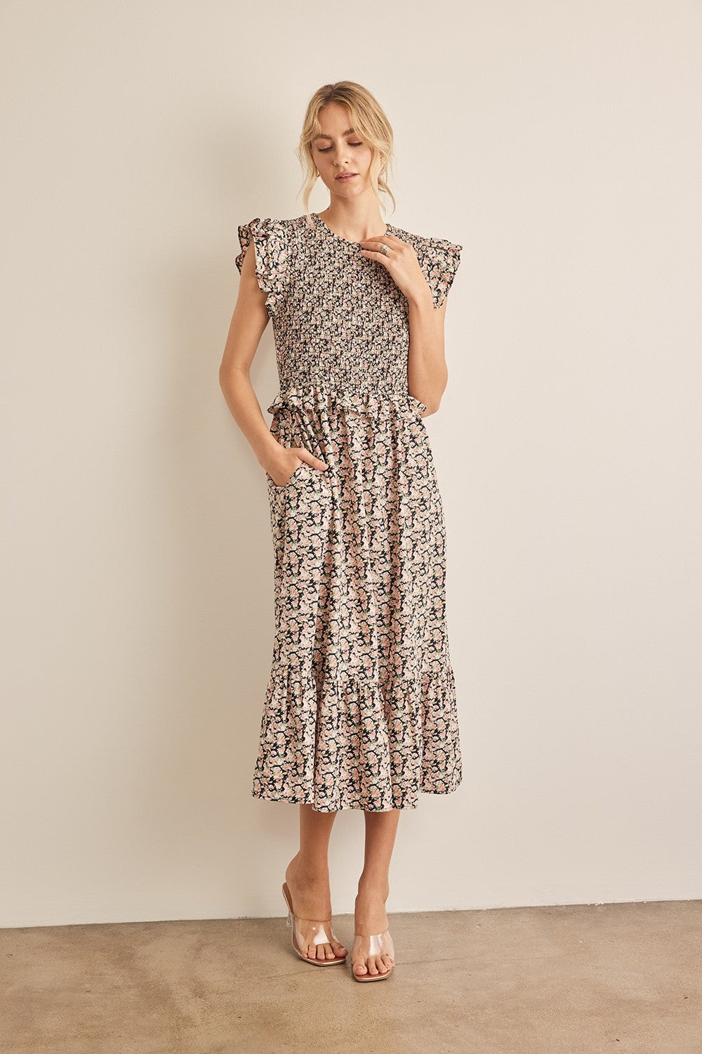 The Floral Smocked Ruffled Midi Dress is a feminine and elegant choice for any occasion. 