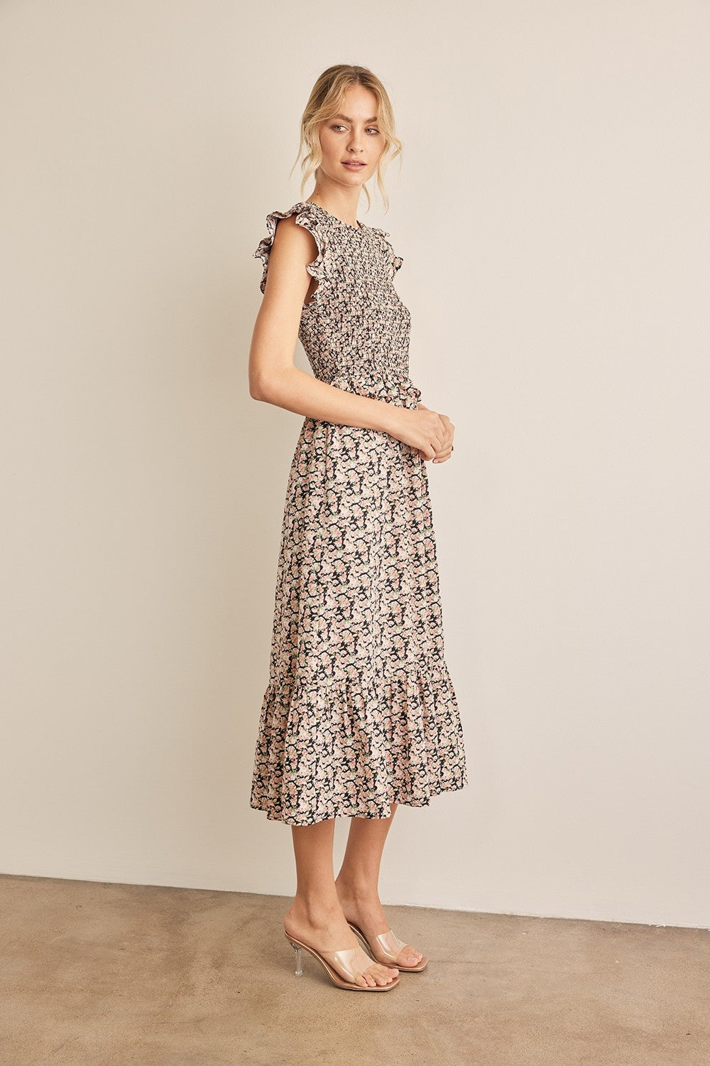 The Floral Smocked Ruffled Midi Dress is a feminine and elegant choice for any occasion. 