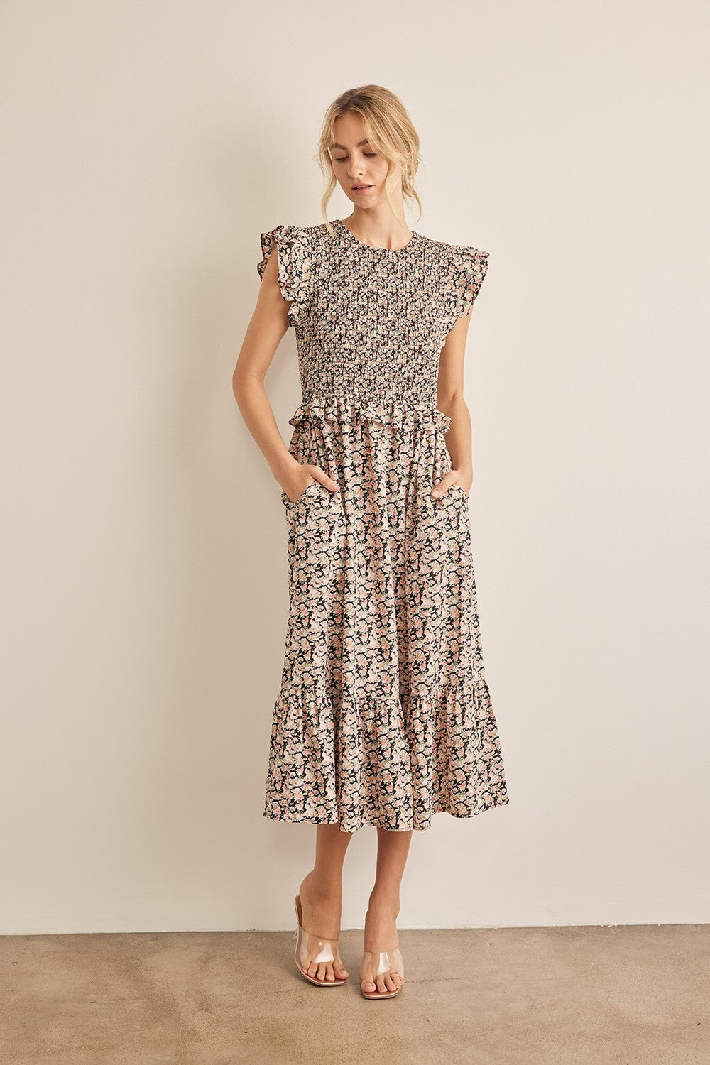 The Floral Smocked Ruffled Midi Dress is a feminine and elegant choice for any occasion. 