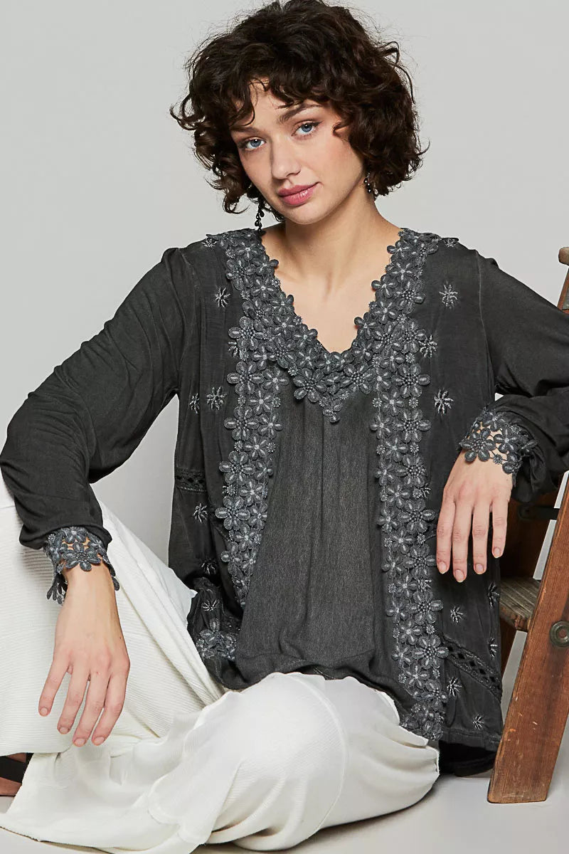The Floral Embroidery Woven Top offers a relaxed fit and delicate floral lace trim along the low V neckline. Floral embroidery detailing on the side front adds a charming touch to the design. 