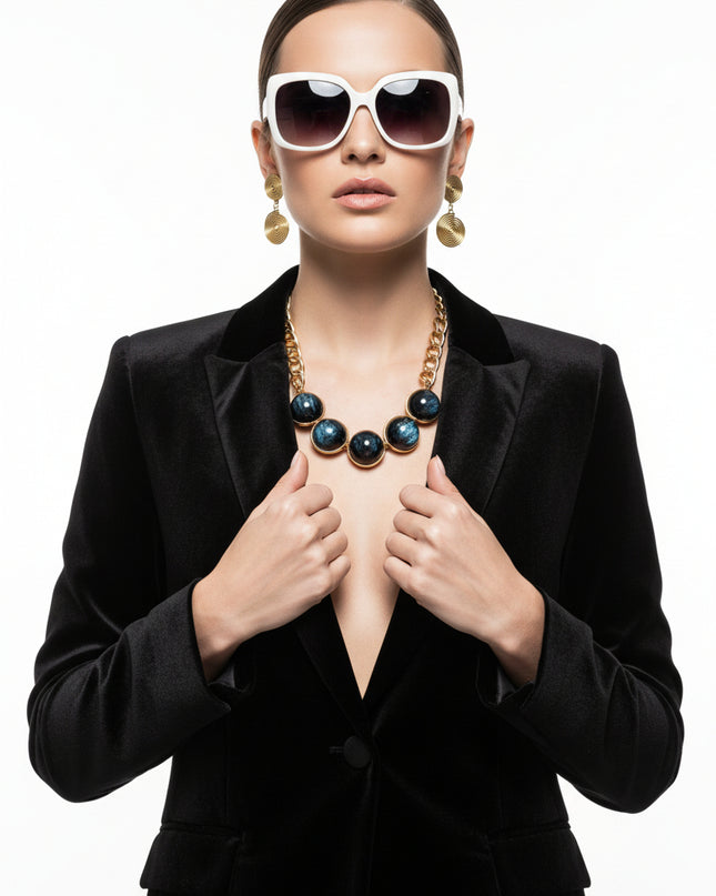 Women's Collar Necklace Set. Glossy and Galactic Chunky Gold Metal Chain Necklace with Eye-catching Centerpiece Collar Comprised of Jumbo Black Resin Ball Beads Featuring Swirled Blue Glitter Inlay and Hand-wrapped Gold Metal Wire Detail. 