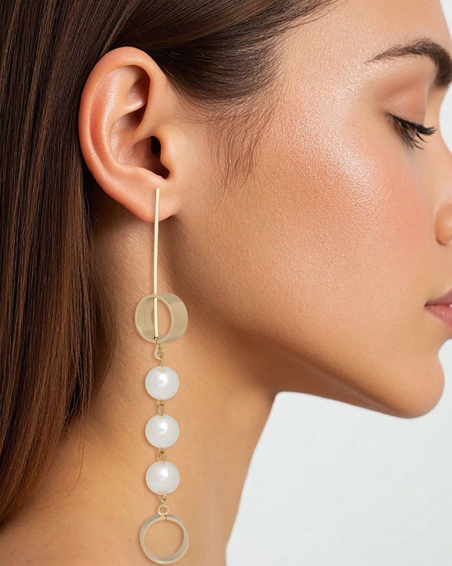 Women's Dangle Earrings. Long Shoulder-Duster Modern Geometric Design Gold Metal and Acrylic Cream Dangle Earrings Featuring Long Bar and Circle Design with Linked Pearls.