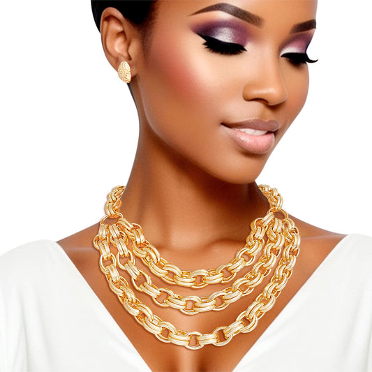 Women's Chain Necklace Set Chunky Hollow Gold Metal Textured Oval Double Link Necklace Featuring Triple Layer Chain Detail. Layered Chain Detail measures 2.25" wide. Lobster Clasp Closure. Includes Matching Hammered Button Stud Post Backing Earrings.