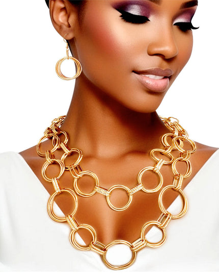 Women's Chain Necklace Set Chunky Double Layer Chain Necklace Featuring Triple Gold Metal Rings Linked with Textured Oval Links. Large Rings Measure 1.5" each. Necklace measures 20" to 26". Lobster Clasp Closure. Include Matching Triple Ring Fishhook Earrings.