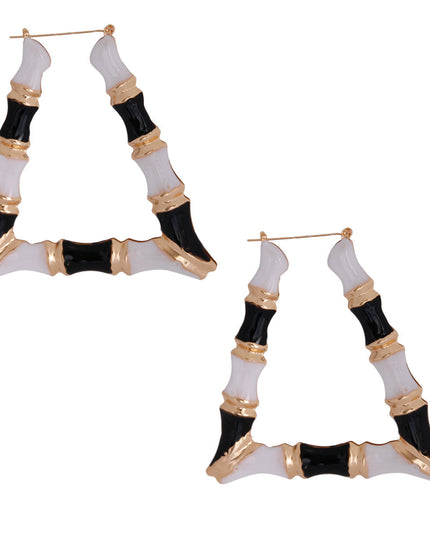 Gold Metal with Black and White Epoxy Hollow Trapezoid Bamboo Hoop Earrings. Earrings measure 3.5 inches wide