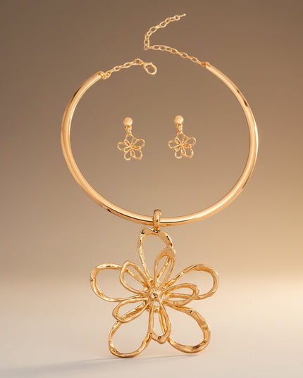 Gold rigid metal flower necklace with a hammered texture.