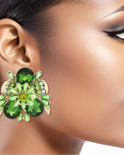 Women's Clip-On Earrings Gold Metal Flower Clip-Ons Featuring Green Teardrop Crystals, Rhinestones, Oblong Pearls, and Green Leaf Details. Paddle Back Clip-Ons.