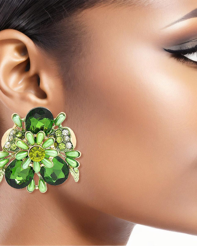 Women's Clip-On Earrings Gold Metal Flower Clip-Ons Featuring Green Teardrop Crystals, Rhinestones, Oblong Pearls, and Green Leaf Details. Paddle Back Clip-Ons.