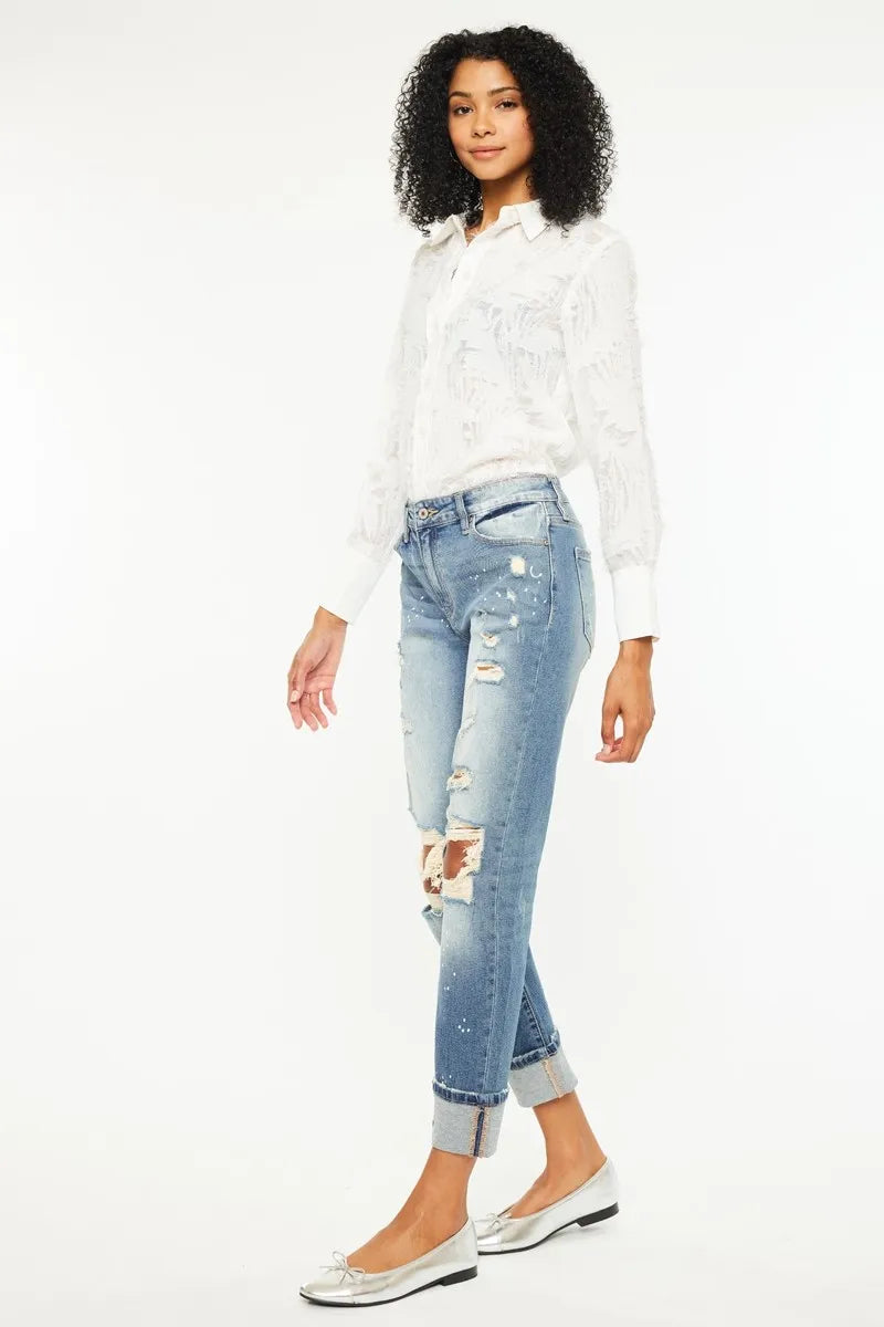 The edgy distressed details add a touch of cool and casual vibe to the classic boyfriend jeans style. 