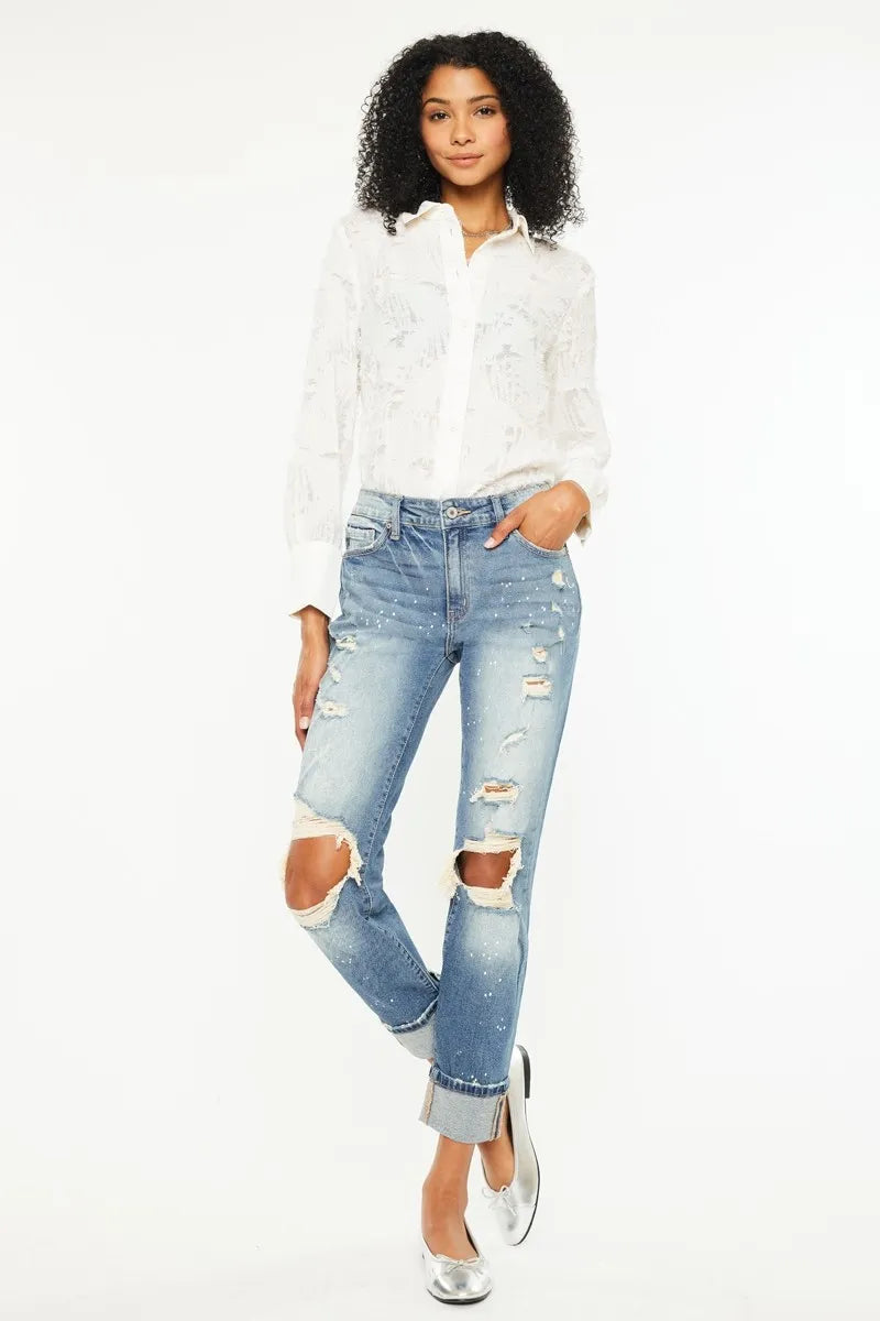 The edgy distressed details add a touch of cool and casual vibe to the classic boyfriend jeans style. 