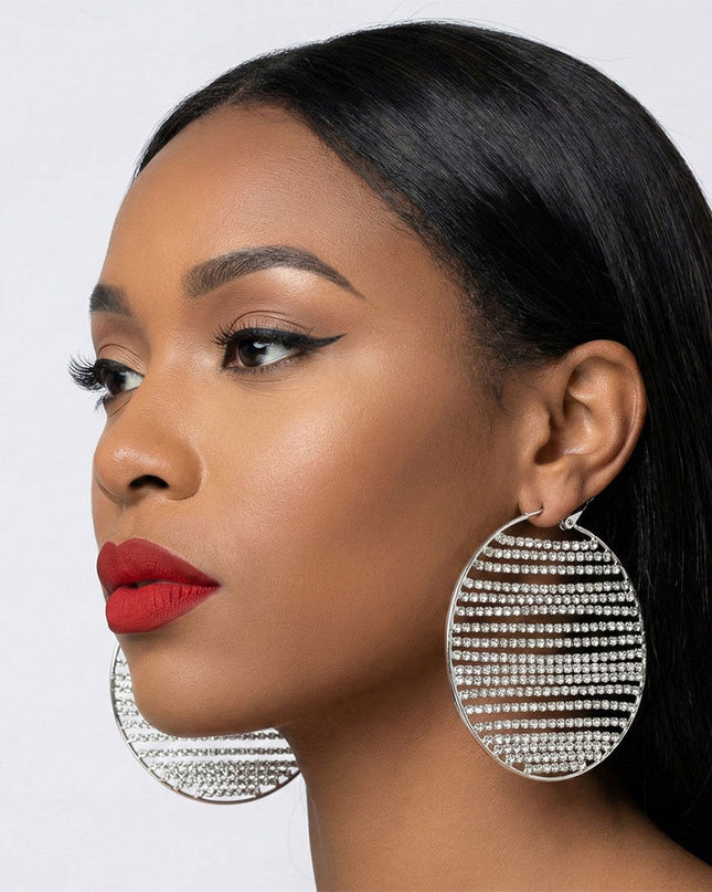 Women's Hoop Earrings. Dazzling Red-Carpet Ready Silver Metal Hoop Earrings Featuring Linear Vertical Rows of Clear Rhinestones. Omega Hoop Closure.