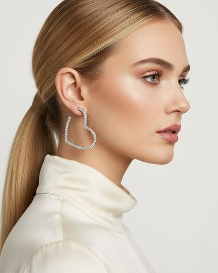 Women's Hoop Earrings. Sweet Sparkle Silver Metal Heart Shaped Open Hoop Earrings Featuring Clear Pave Rhinestone Detailing. 