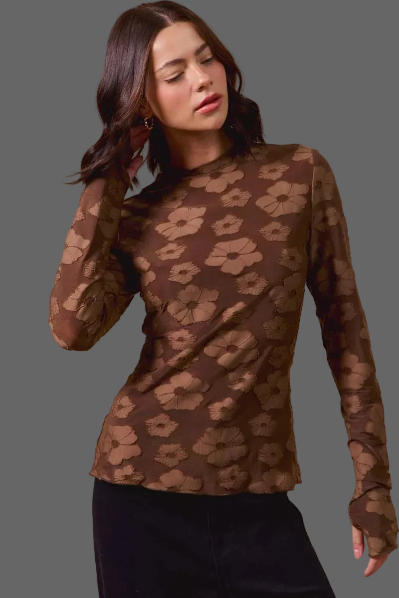 These casual tops are crafted from a stretchy jacquard fabric that offers both comfort and style. The thumb openings add a trendy and practical detail, perfect for keeping your hands warm on chilly days.