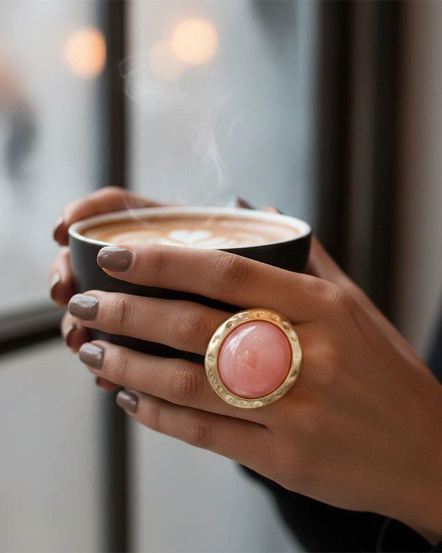 Women's Cocktail Ring. Style Statement Large Domed Round Marbled Pink Resin Cocktail Ring with Matte Gold Hammered Metal Edge. Stretch Metal Band.
