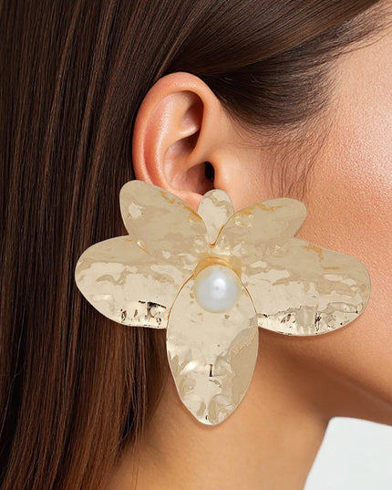 Women's Stud Earrings. Oversized Large Gold Hammered Metal Sculpted Petal Flower Shaped Stud Earrings Featuring Lustrous Acrylic Cream Pearl Center. 