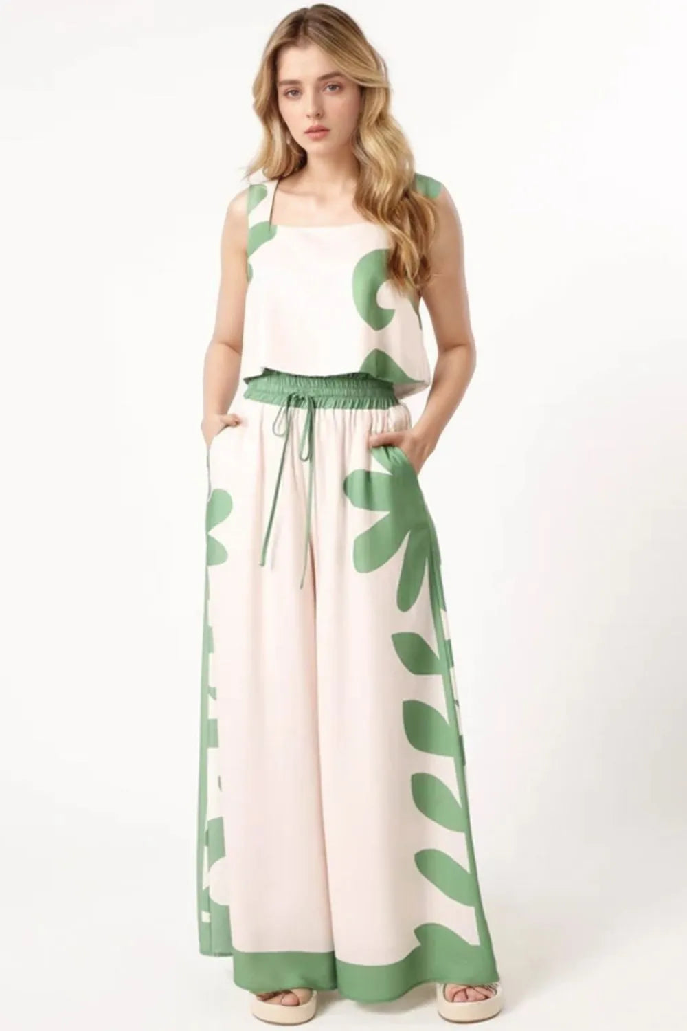 Sleeveless top and wide-leg pants with green leaf patterns