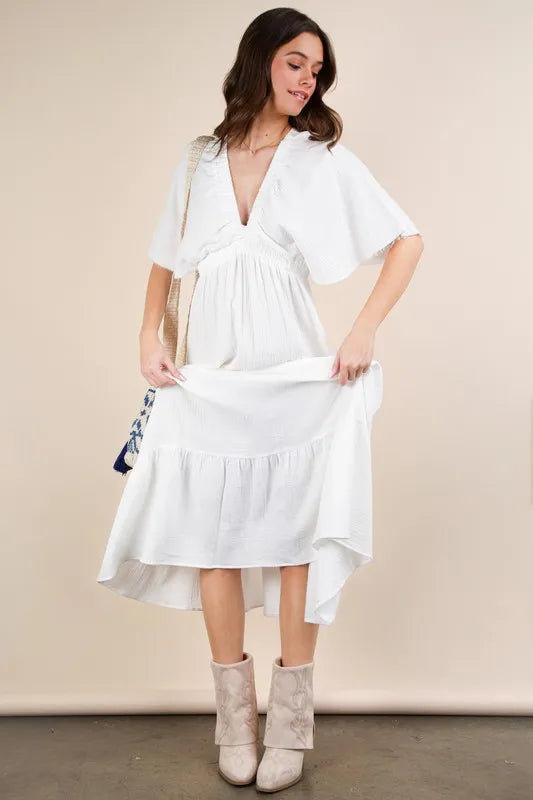 The Mineral Washed Elastic Neck Detail Midi Dress is a versatile and chic option for any occasion. This dress features a flattering midi length and a unique elastic neck detail for added style. The mineral wash gives it a trendy, vintage look that is perfect for both casual and dressed up looks.