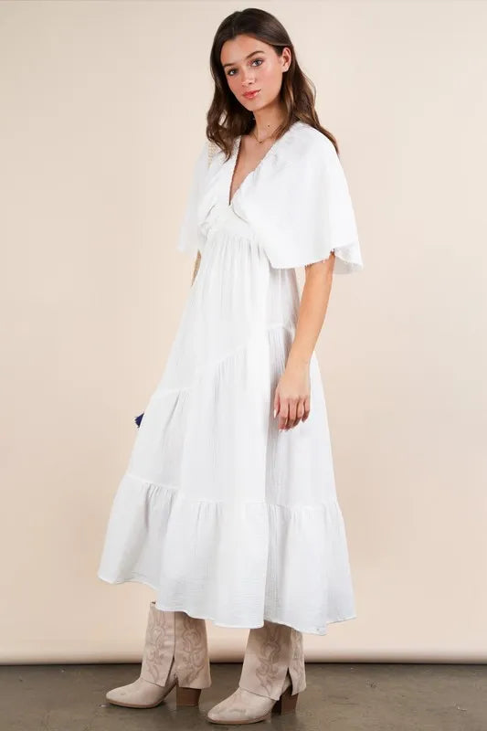 The Mineral Washed Elastic Neck Detail Midi Dress is a versatile and chic option for any occasion. This dress features a flattering midi length and a unique elastic neck detail for added style. The mineral wash gives it a trendy, vintage look that is perfect for both casual and dressed up looks.