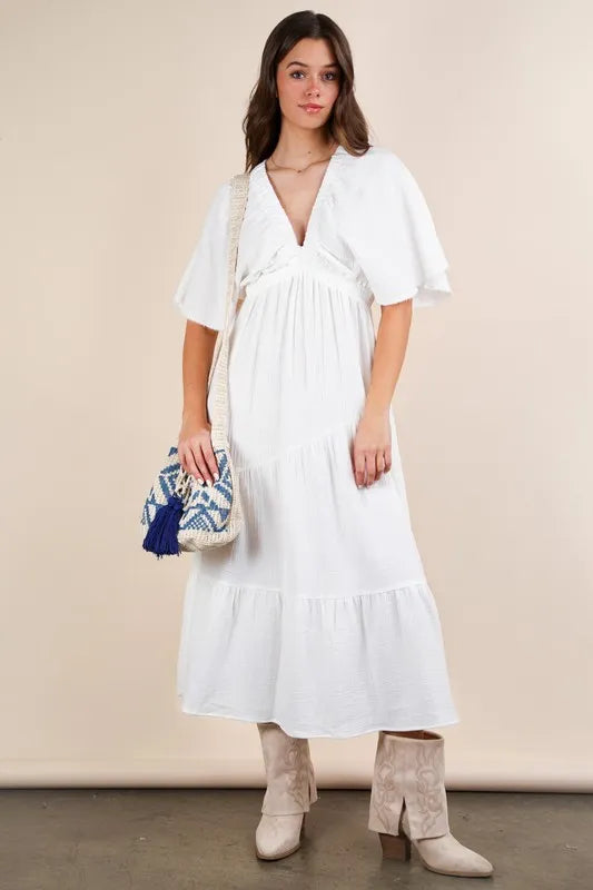 The Mineral Washed Elastic Neck Detail Midi Dress is a versatile and chic option for any occasion. This dress features a flattering midi length and a unique elastic neck detail for added style. The mineral wash gives it a trendy, vintage look that is perfect for both casual and dressed up looks.