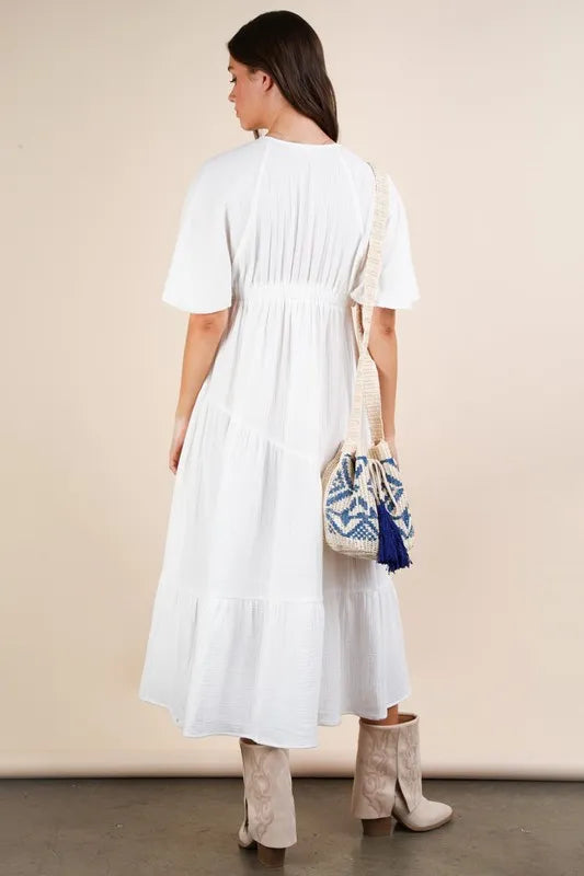 The Mineral Washed Elastic Neck Detail Midi Dress is a versatile and chic option for any occasion. This dress features a flattering midi length and a unique elastic neck detail for added style. The mineral wash gives it a trendy, vintage look that is perfect for both casual and dressed up looks.