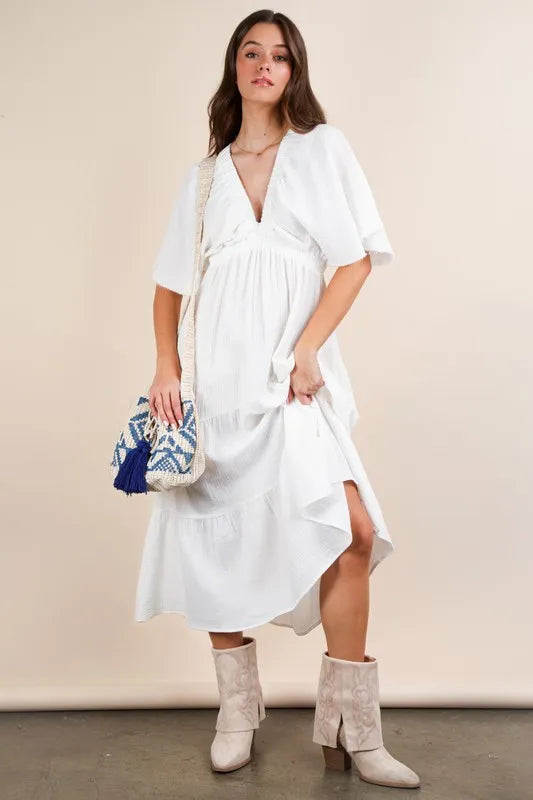 The Mineral Washed Elastic Neck Detail Midi Dress is a versatile and chic option for any occasion. This dress features a flattering midi length and a unique elastic neck detail for added style. The mineral wash gives it a trendy, vintage look that is perfect for both casual and dressed up looks.
