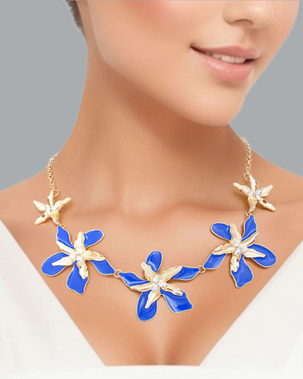 Women's Collar Necklace Gold Metal Round Link Chain Featuring Textured Gold Metal and Blue Epoxy Tropical Iris Flowers with Rhinestone Centers. Flowers measure 2.15" each. Lobster Clasp Closure.