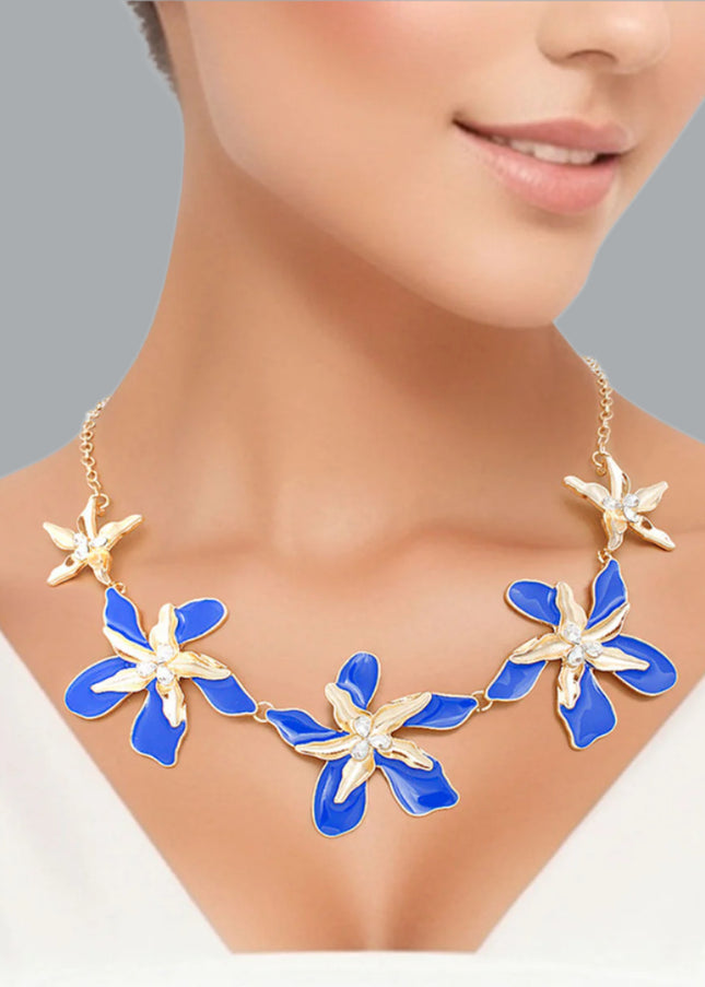 Women's Collar Necklace Gold Metal Round Link Chain Featuring Textured Gold Metal and Blue Epoxy Tropical Iris Flowers with Rhinestone Centers. Flowers measure 2.15" each. Lobster Clasp Closure.