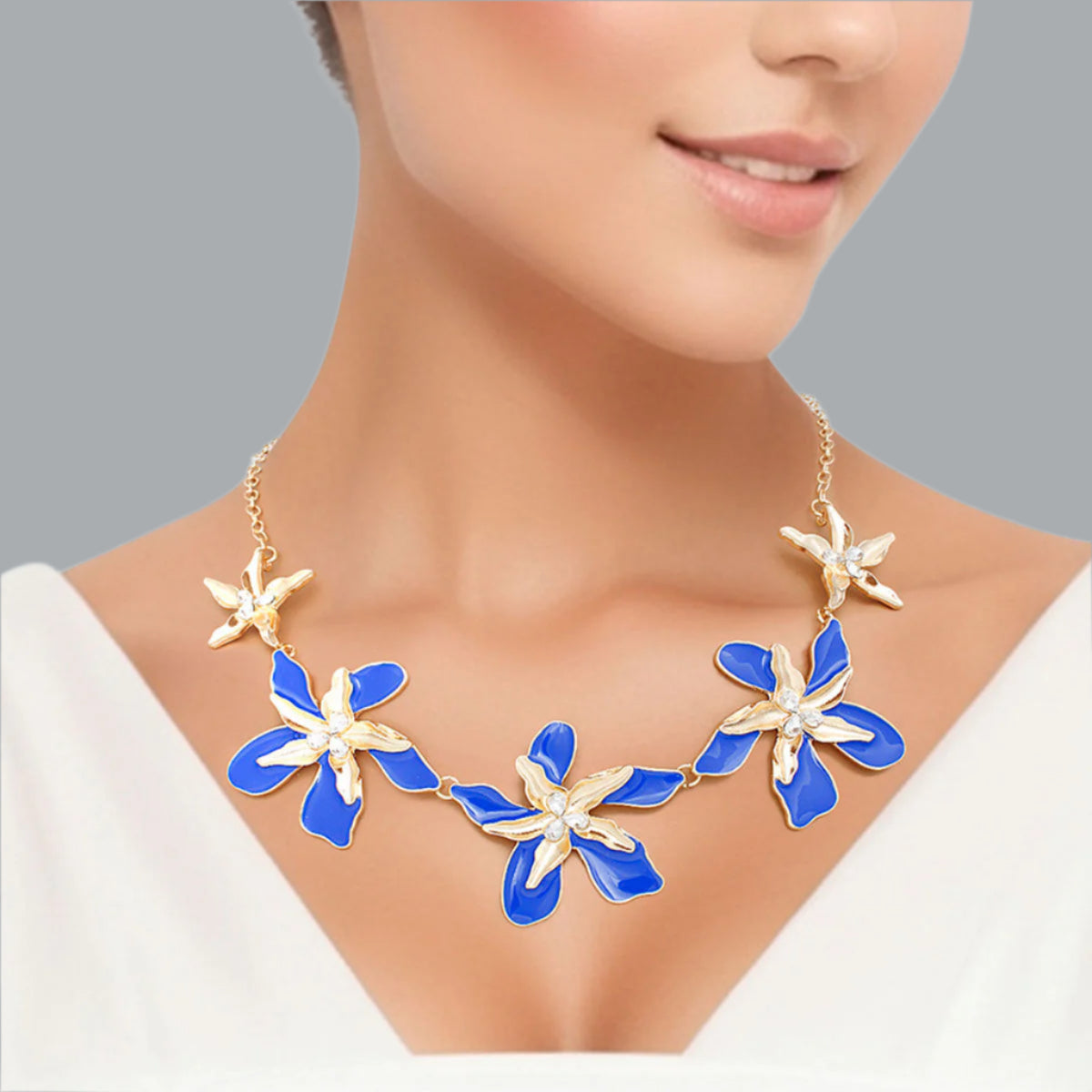 Women's Collar Necklace Gold Metal Round Link Chain Featuring Textured Gold Metal and Blue Epoxy Tropical Iris Flowers with Rhinestone Centers. Flowers measure 2.15" each. Lobster Clasp Closure.