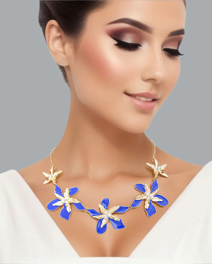 Women's Collar Necklace Gold Metal Round Link Chain Featuring Textured Gold Metal and Blue Epoxy Tropical Iris Flowers with Rhinestone Centers. Flowers measure 2.15" each. Lobster Clasp Closure.