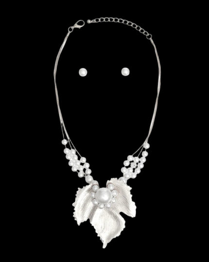 Women's Pendant Necklace Set 3 Strand Elegant Silver Metal Snake Chain Necklace Featuring White Pearl Slides and Textured Metal Leaf Pendant with Pearls. Pendant measures 3.25" x 3.25". Lobster Clasp Closure. Includes Matching Pearl Ball Stud Post Backing Earrings.