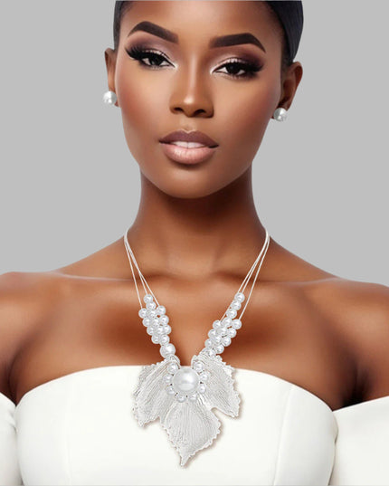 Women's Pendant Necklace Set 3 Strand Elegant Silver Metal Snake Chain Necklace Featuring White Pearl Slides and Textured Metal Leaf Pendant with Pearls. Pendant measures 3.25" x 3.25". Lobster Clasp Closure. Includes Matching Pearl Ball Stud Post Backing Earrings.