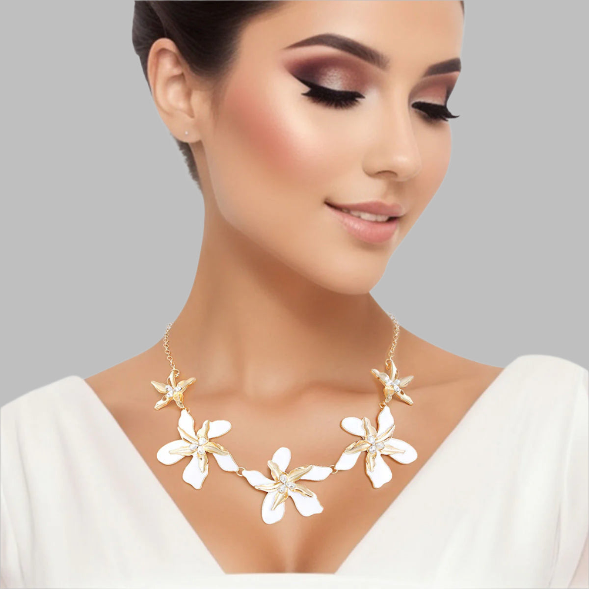 Women's Collar Necklace Gold Metal Round Link Chain Featuring Textured Gold Metal and White Epoxy Tropical Iris Flowers with Rhinestone Centers. Flowers measure 2.15" each. Lobster Clasp Closure.
