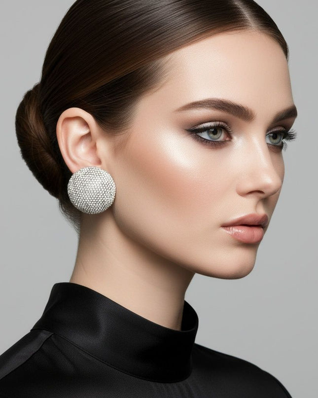 Women's Clip On Earrings. Maximum Sparkle Statement Earrings. Bold Hollow Gold Metal Oversized Domed Clip On Earrings Encrusted with Shimmering Clear Rhinestones.